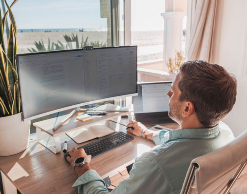 ceo co-founder of speedy working on computer at desk with view