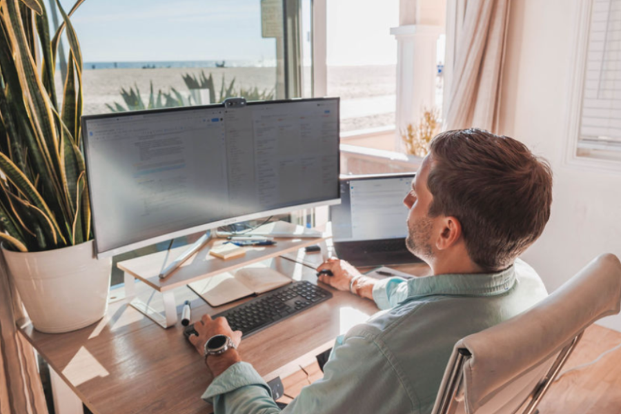 ceo co-founder of speedy working on computer at desk with view